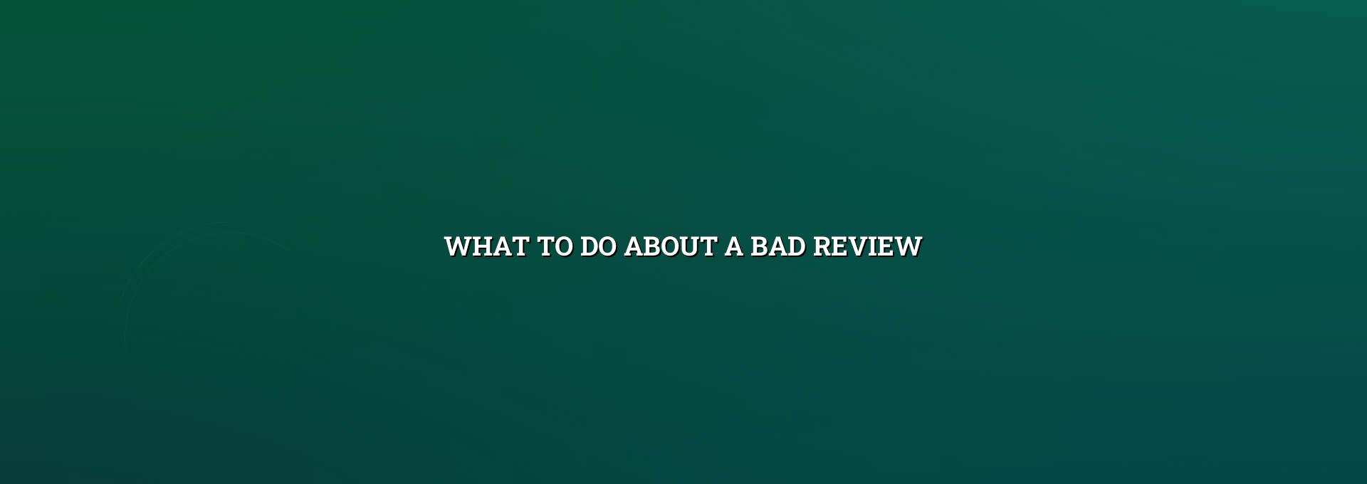 Business owner replying to a bad review on a phone and laptop